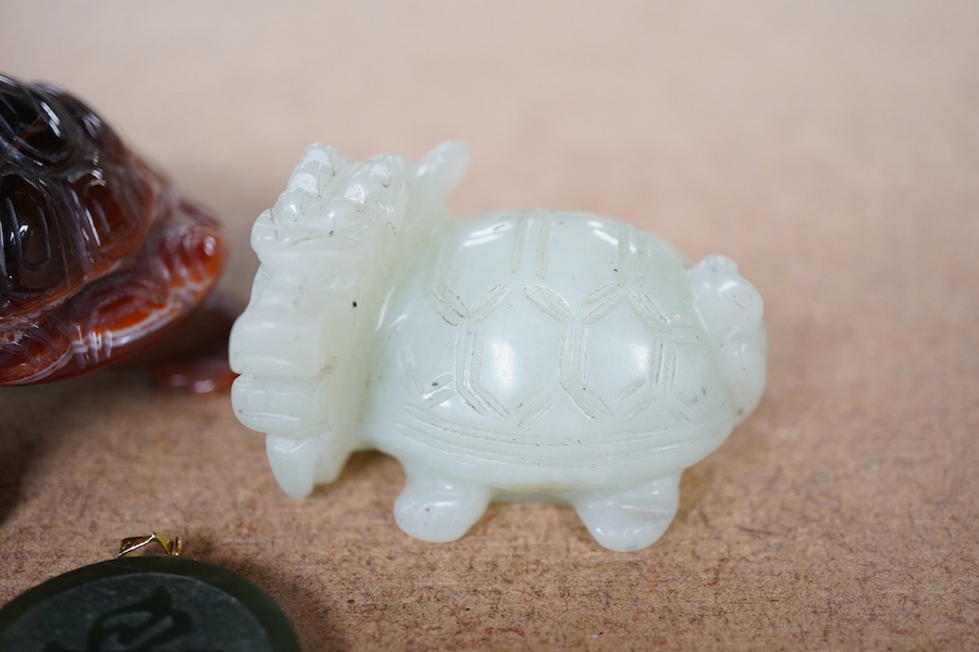 A Chinese carved jade pendant and two hardstone carved animals, pendant 3cm diameter.